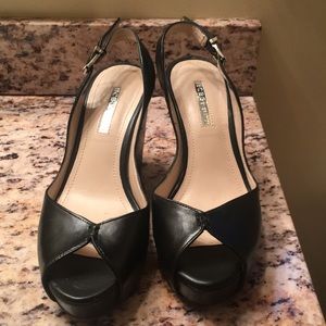 BCBG Generation cute black leather wedges.